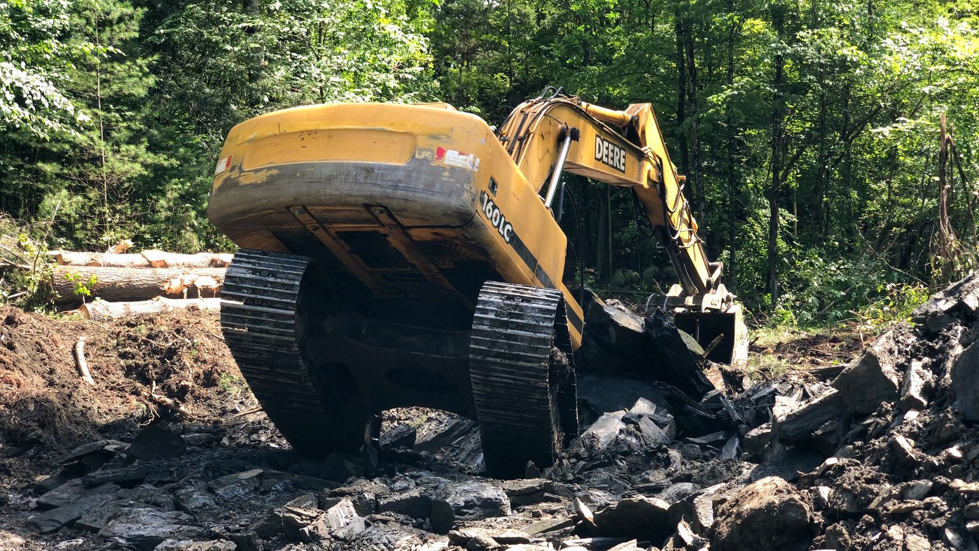 Excavator Removing Bedrock
