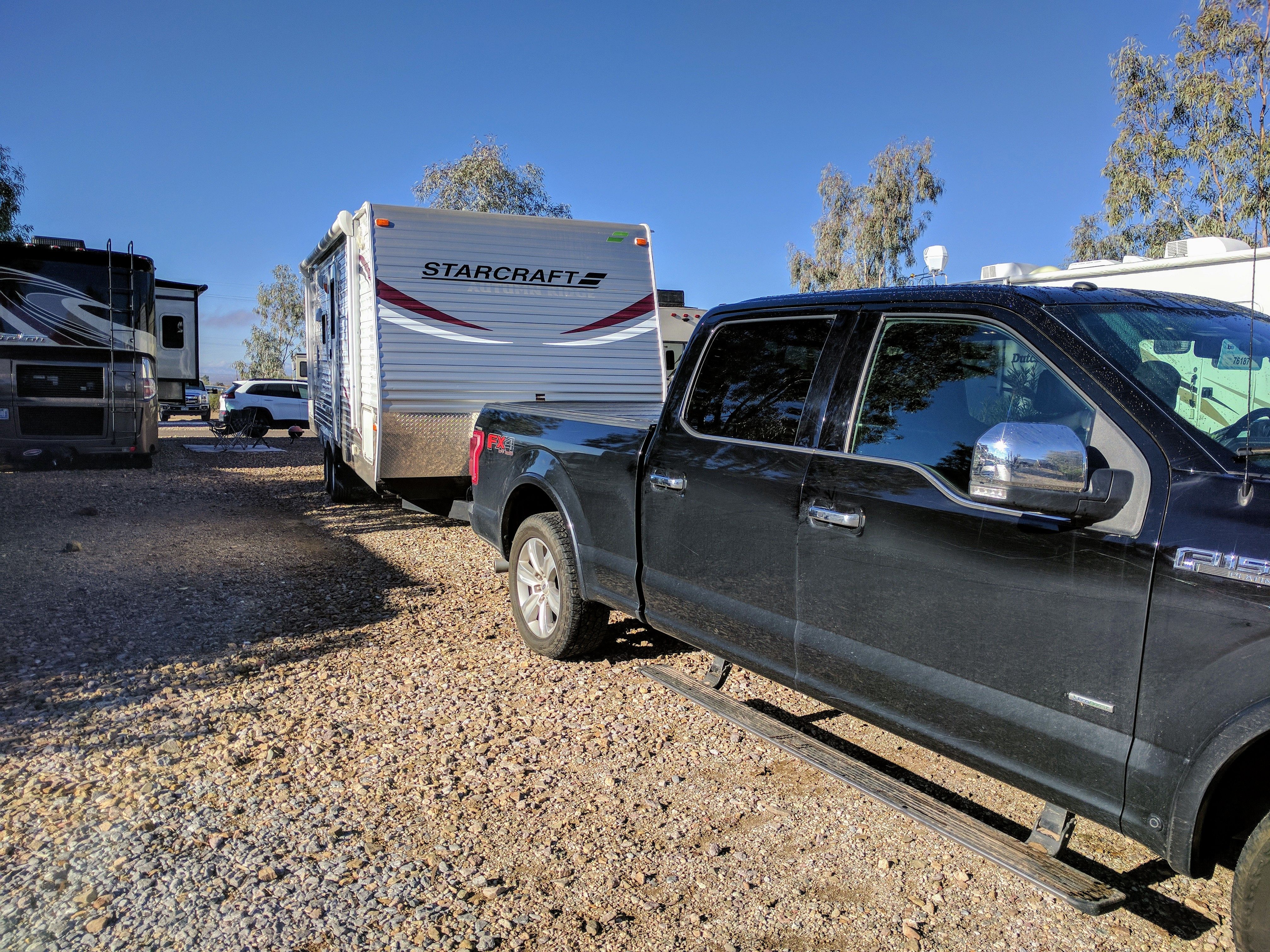 Trailer and truck backed into site at Justin’s Diamond J RV Park