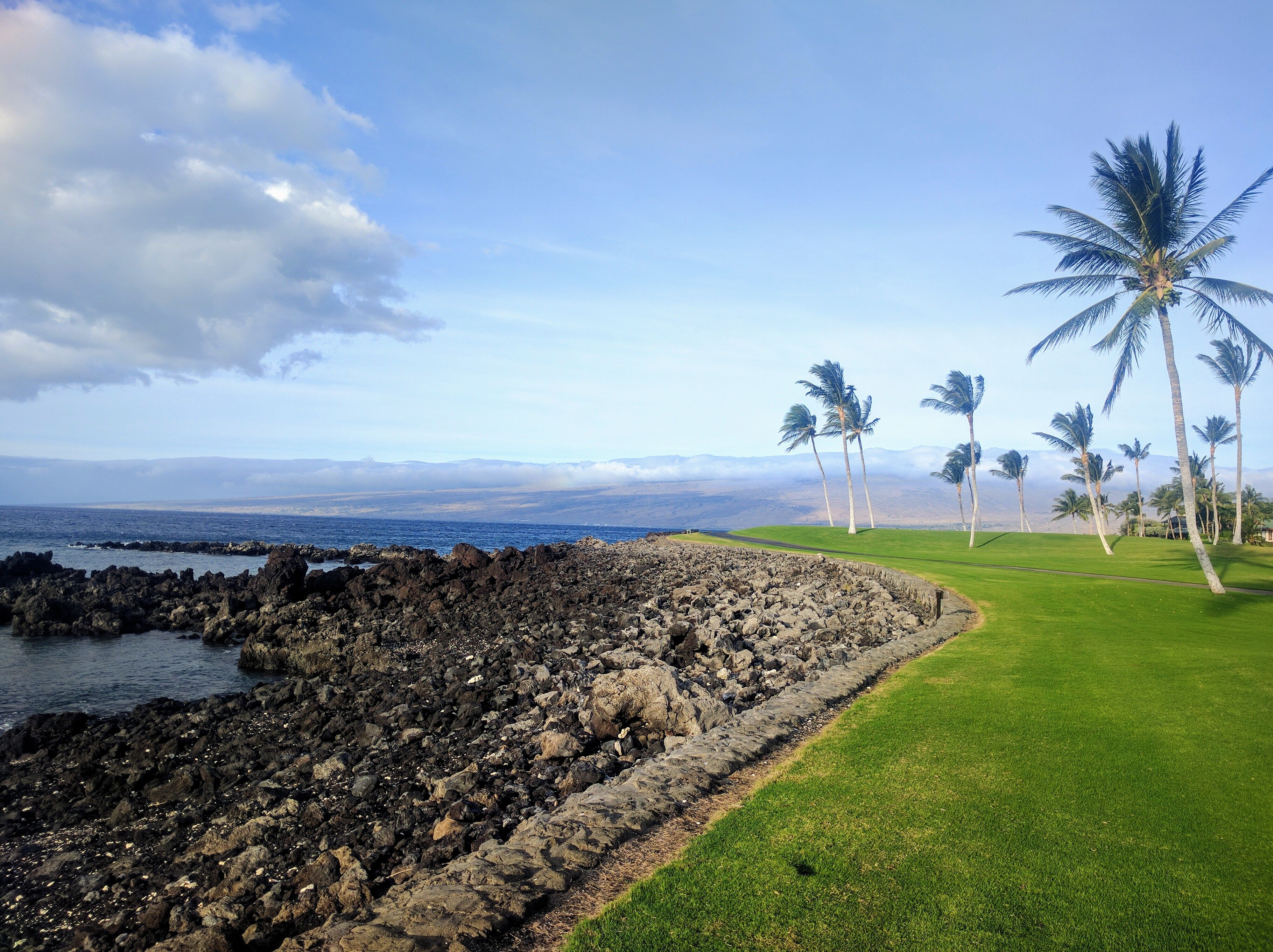 Golf course right by the ocean.