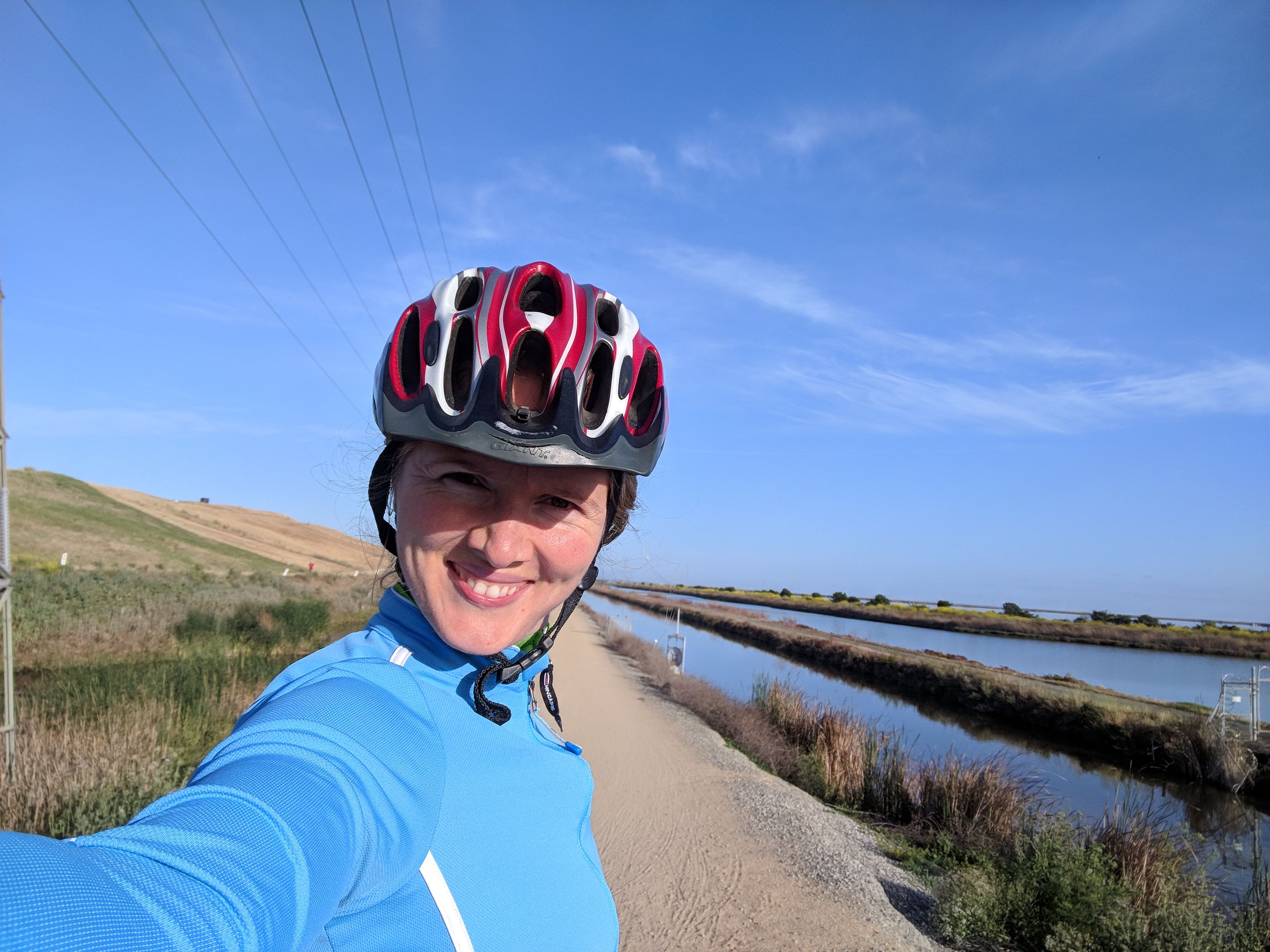 Diana biking along the San Francisco Bay
