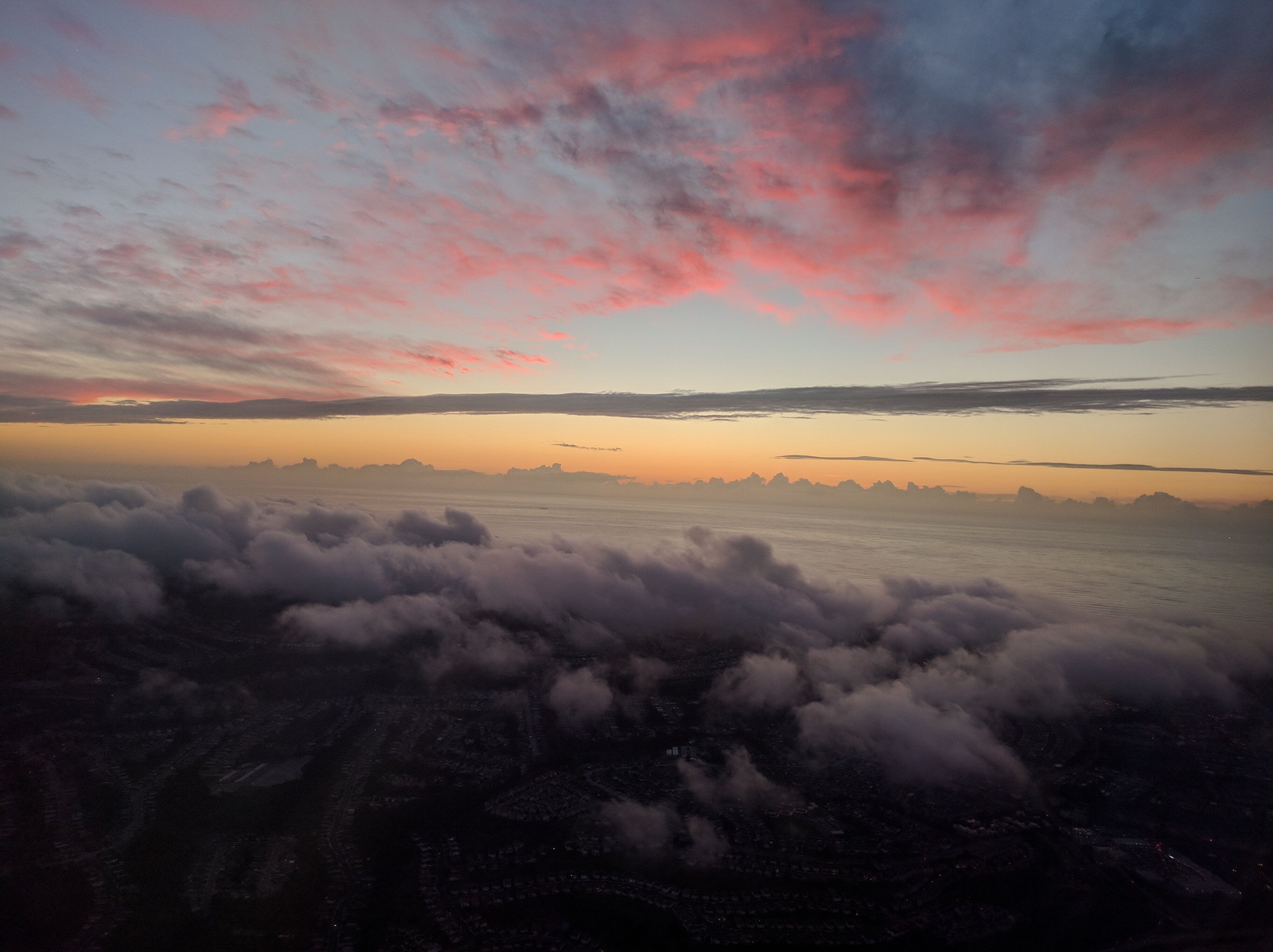 Clouds colored in red and yellow by the sunset.