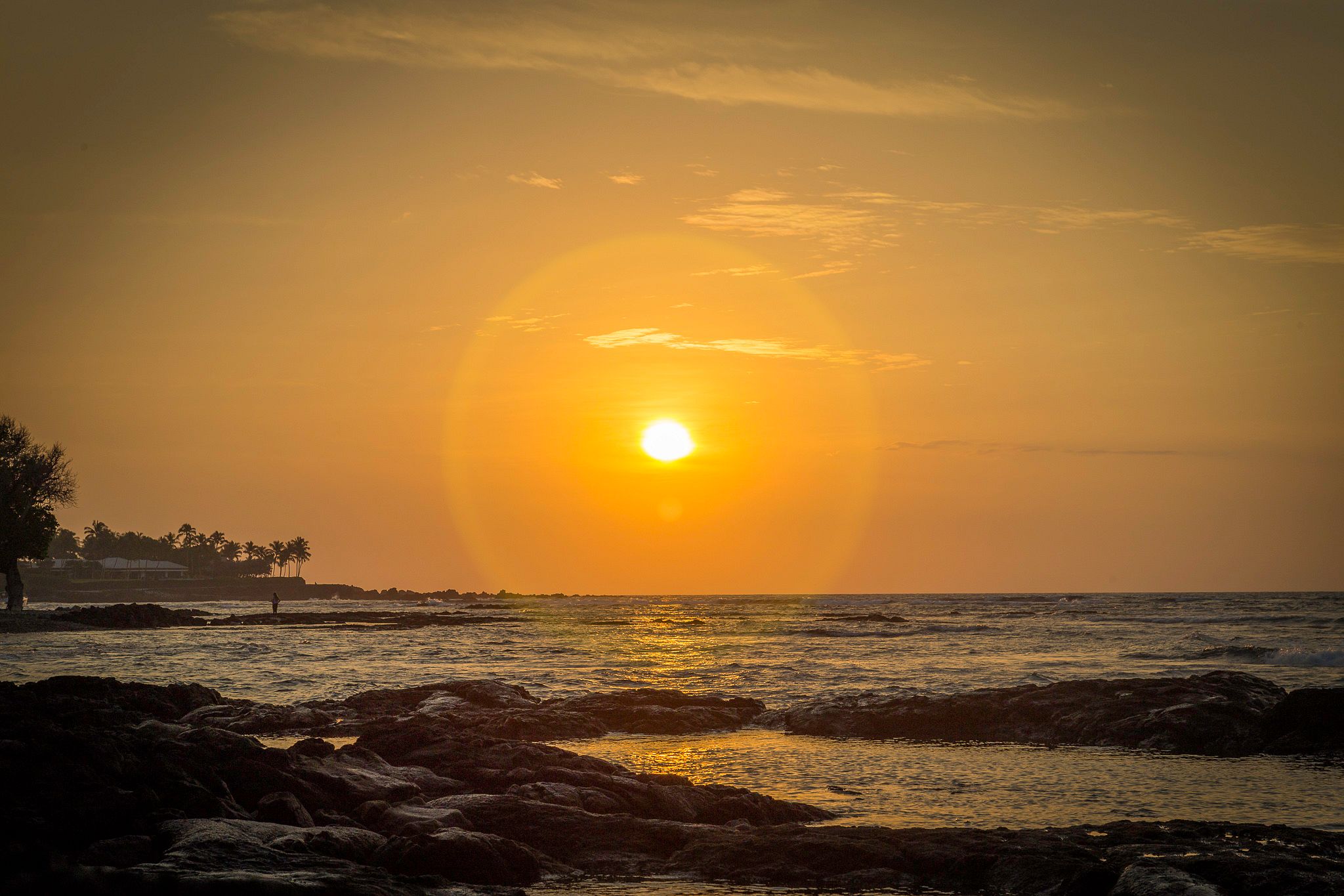 Hawaii sunset in yellow and orange tones.