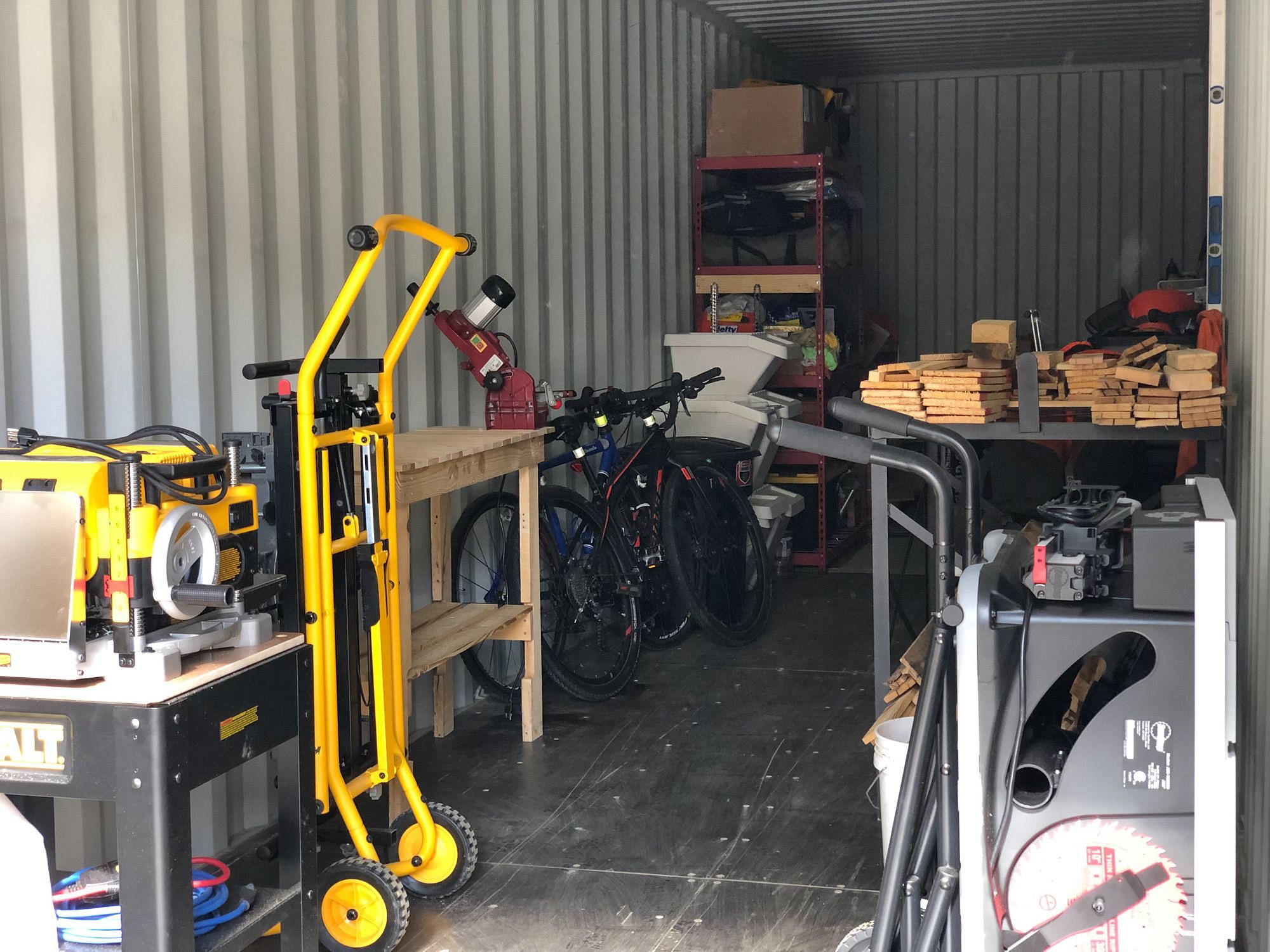 https://www.adventurousway.com/images/i/rw2rbgpk1f4e/2000w/house-build/buying-our-shipping-container/shipping-container-workshop.jpeg